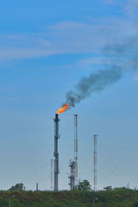 Air polution generated by oil refinery in midia romania flames and smoke