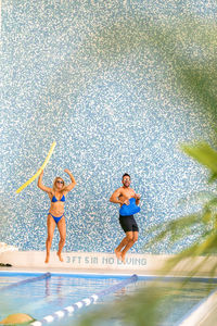 Woman standing in swimming pool