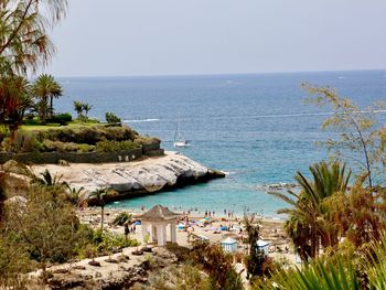 High angle view of swimming pool by sea against clear sky