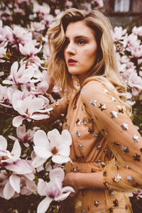 Close-up of woman with pink flowers