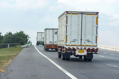 View of empty road against cloudy sky