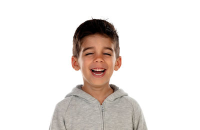 Portrait of smiling boy against white background