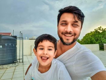 Portrait of happy mother and daughter outdoors