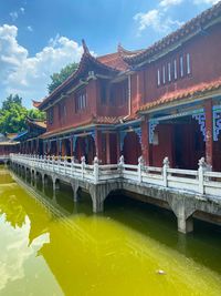 View of bridge over lake against buildings