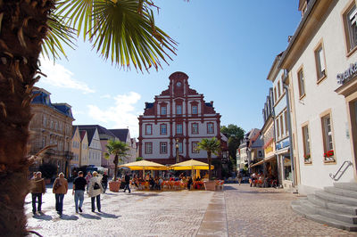 Panoramic view of city street against sky