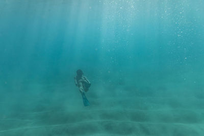 Man swimming in sea