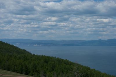 Scenic view of mountains against cloudy sky