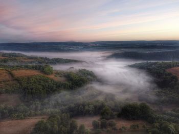 Scenic view of landscape against sky during sunset