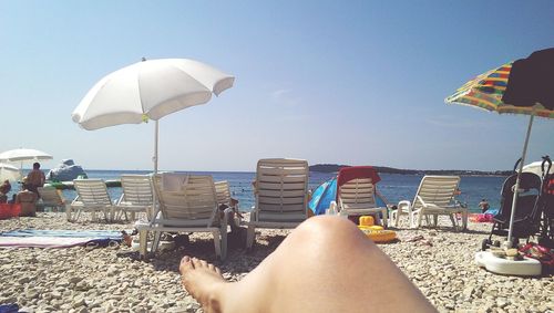 People relaxing on beach