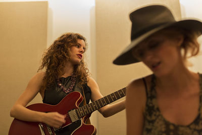 Young musicians practicing at a rehearsal space