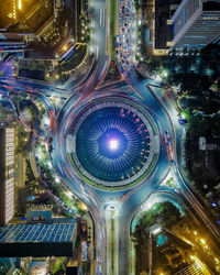 High angle view of city lit up at night