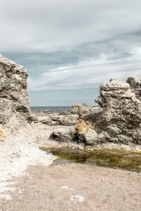 Scenic view of sea and rocks against sky