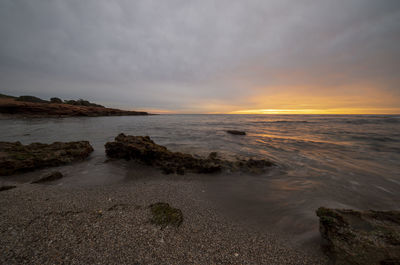 Scenic view of sea against sky during sunset