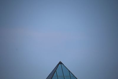 Low angle view of crane against clear sky