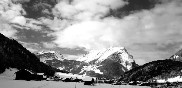 Scenic view of snowcapped mountains against sky