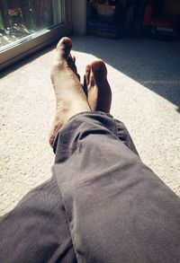 Low section of man relaxing outdoors
