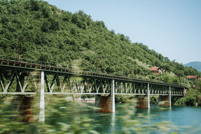 Bridge over river against sky