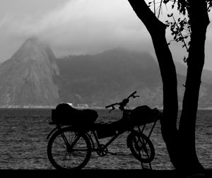 Bicycle on mountain against sky