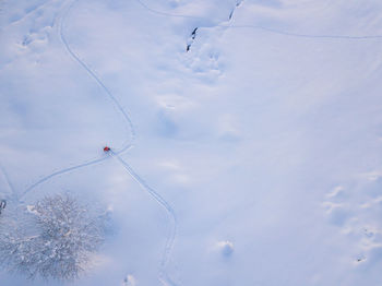 High angle view of snow covered field against sky