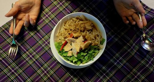 Midsection of man having food in bowl