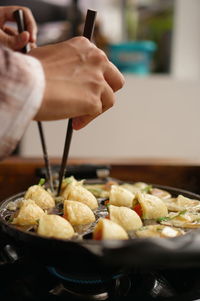 Close-up of person preparing food