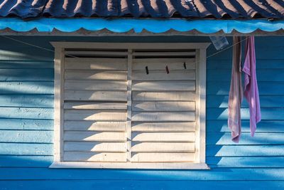 Towels drying against beach hut