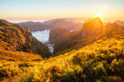 Scenic view of mountains against sky during sunset