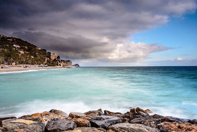 Scenic view of sea against cloudy sky