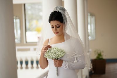 Young woman holding bouquet