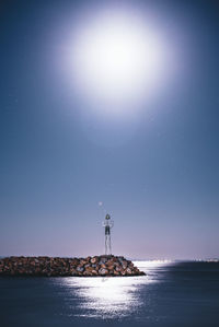 Scenic view of sea against sky at night