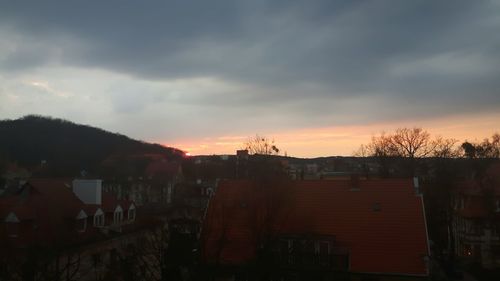 Buildings against cloudy sky