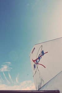 Low angle view of basketball hoop against blue sky