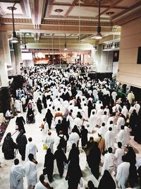 High angle view of people walking in corridor