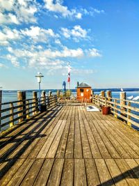 Pier over sea against sky