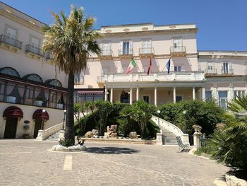 Facade of building with trees in foreground