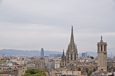 View of buildings in city against sky