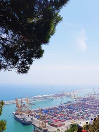 High angle view of boats moored at harbor against sky