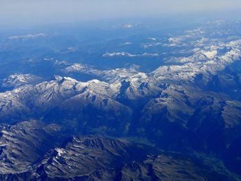 Aerial view of mountains and sea against sky