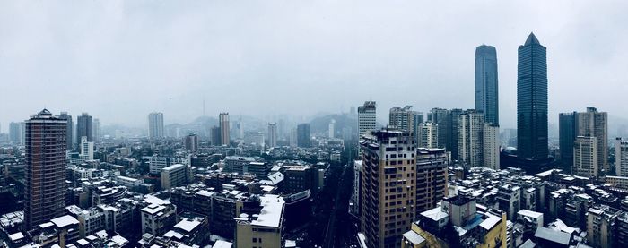 Aerial view of cityscape against sky