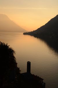 Scenic view of lake against sky during sunset