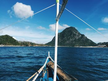 Sailboat on sea against sky