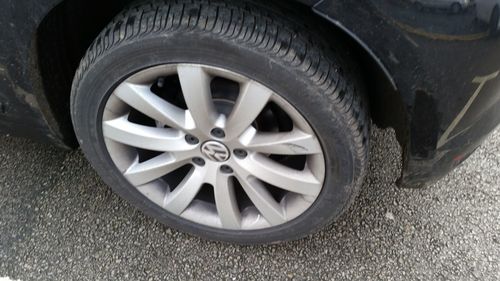 Close-up of tire car on road