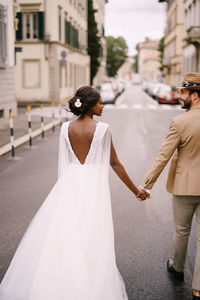 Rear view of couple walking outdoors