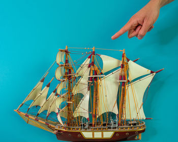 Sailboat on sea against blue sky