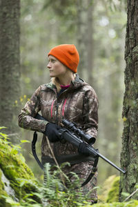 Woman hunting in forest