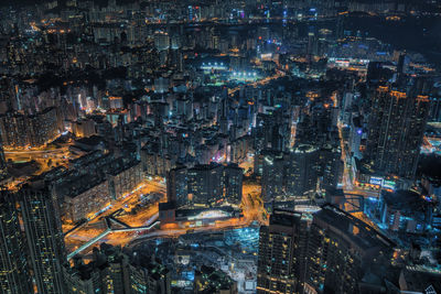 High angle view of city lit up at night