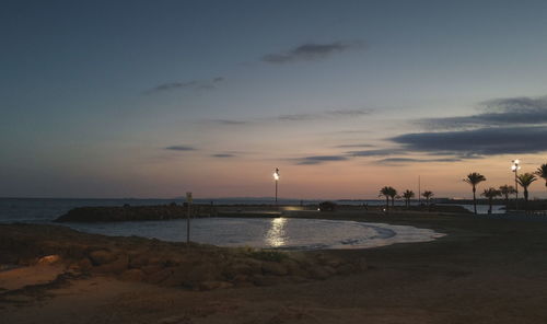 View of beach at sunset