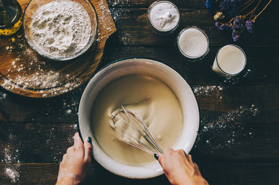 High angle view of person preparing food on table