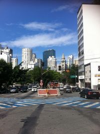 Buildings in city against sky