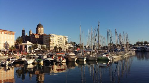 Boats moored at harbor